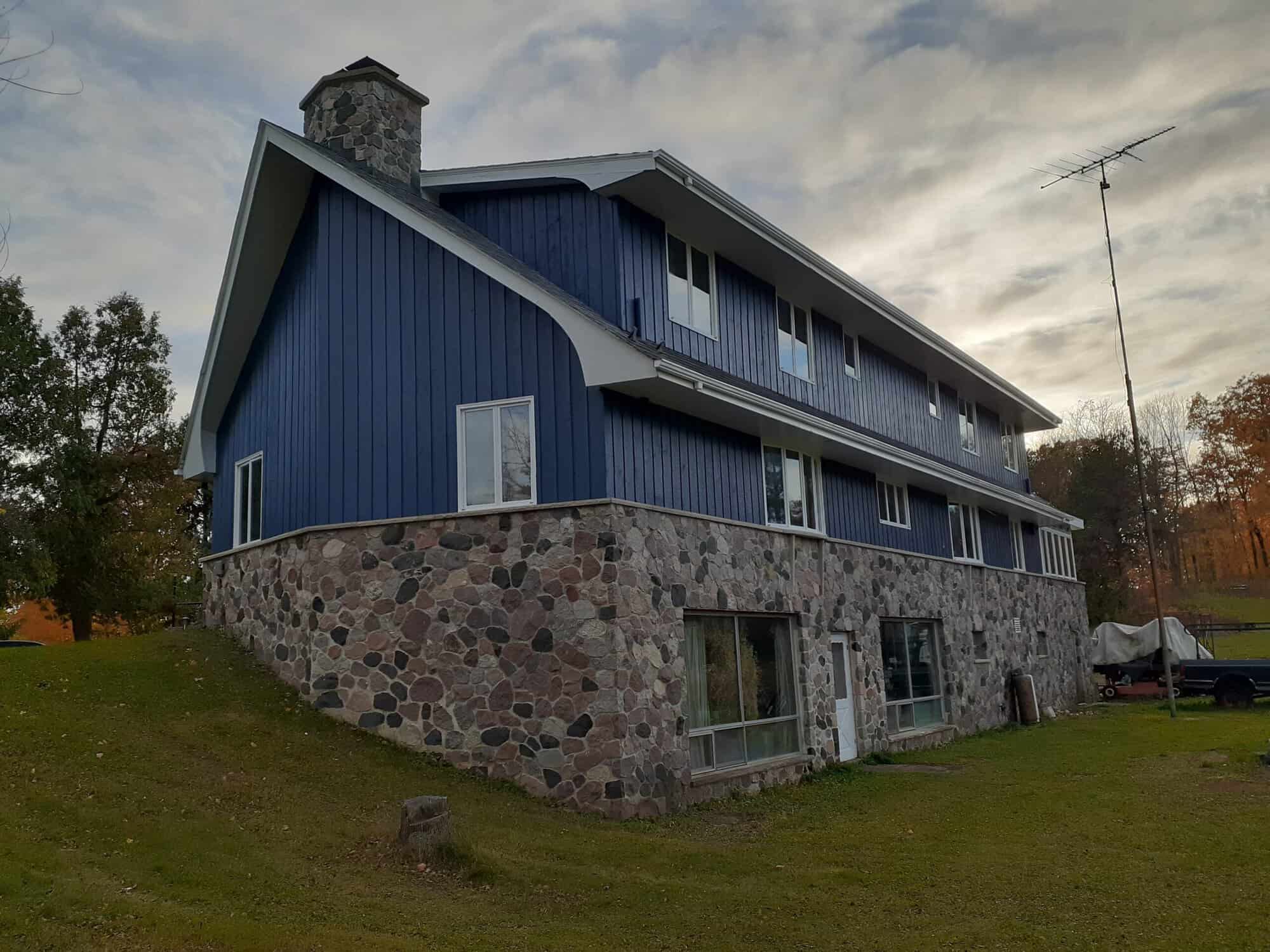 Large blue building with stone sidings