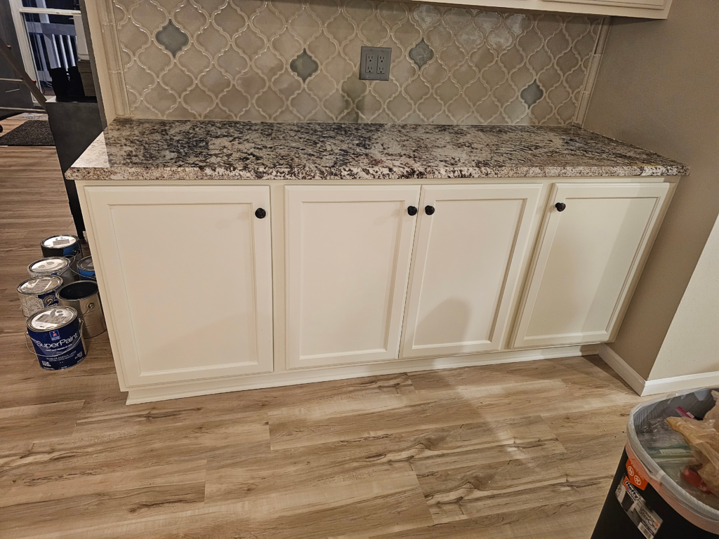 White sink cabinets with granite epoxy countertop