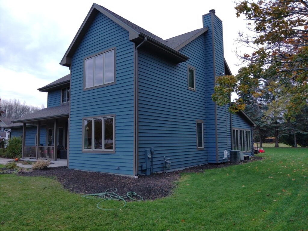 Rear view of a large dark blue house: East Central Wisconsin