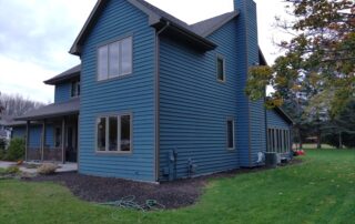 Rear view of a large dark blue house: East Central Wisconsin