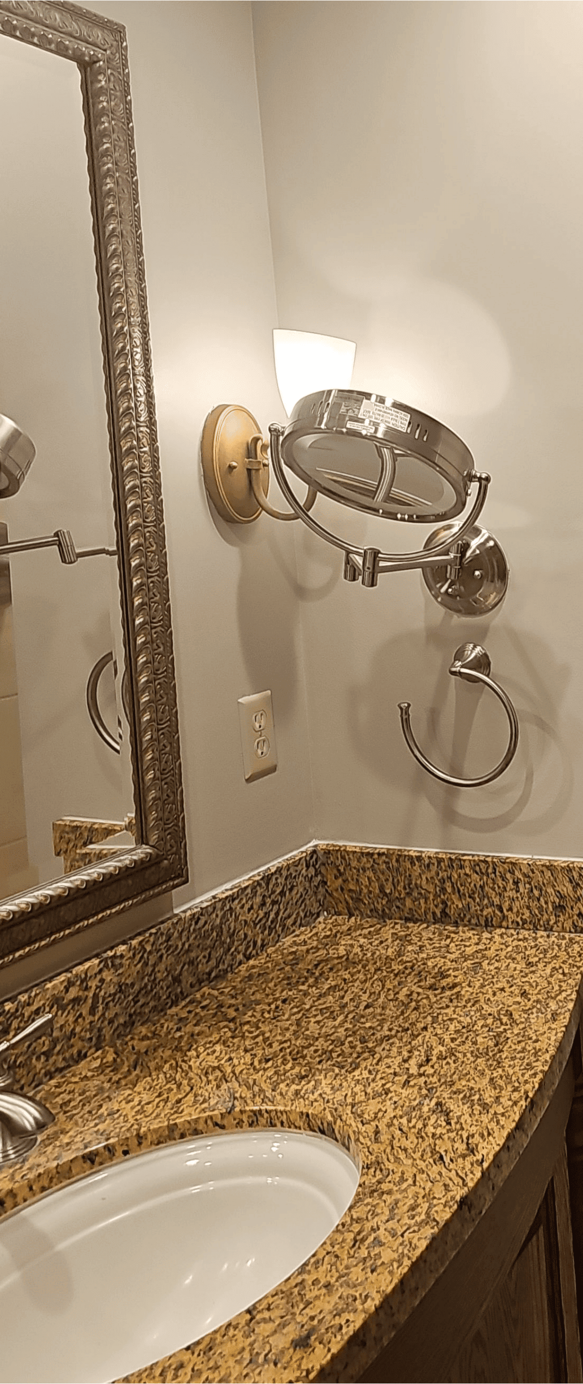 bathroom with large mirror and modern lighting fixtures